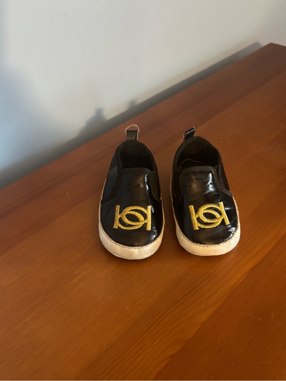 Bebe Black Infants Slip-On Sneakers with Gold Logo